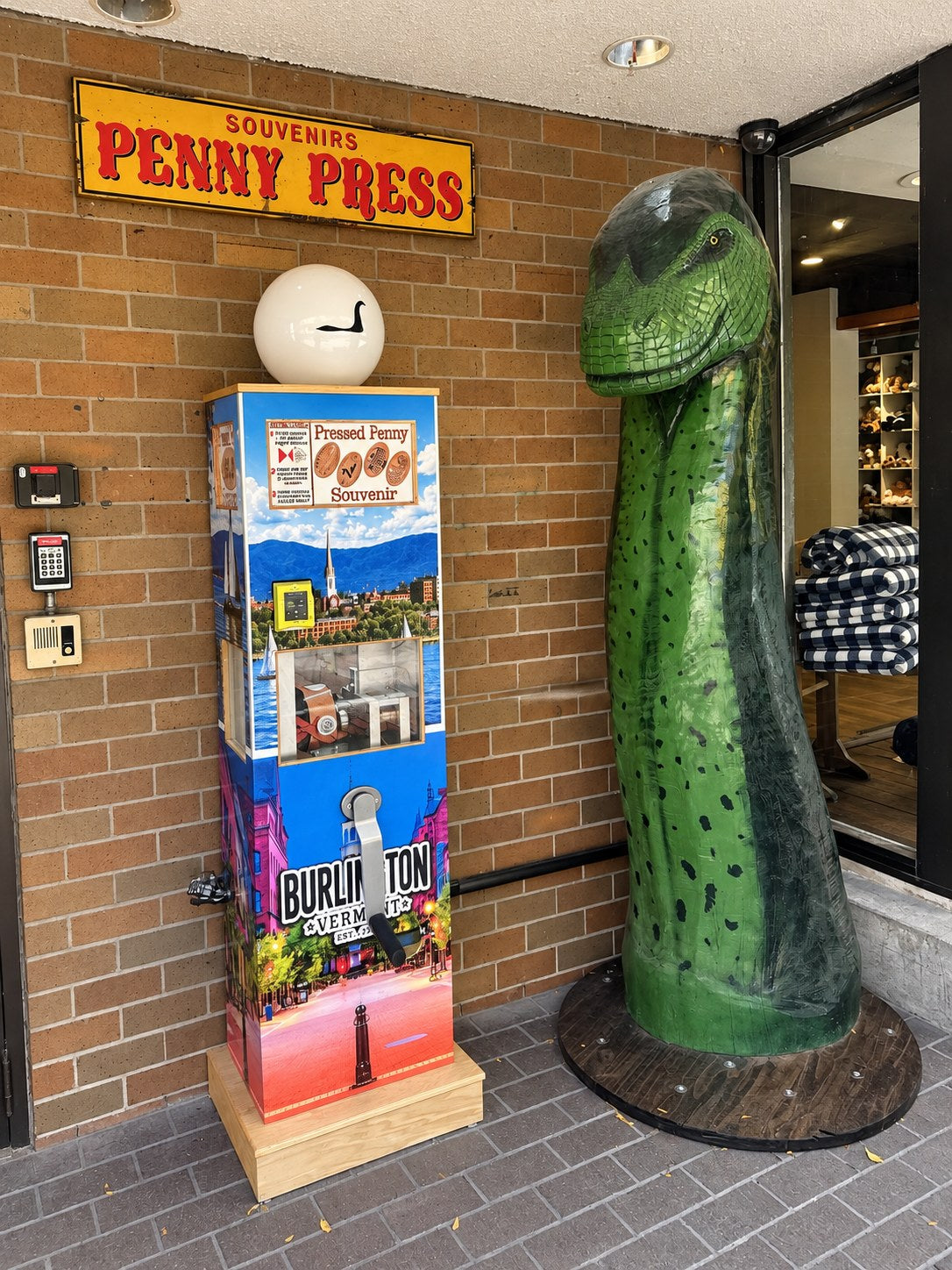 Champ the lake monster statue next to the penny press