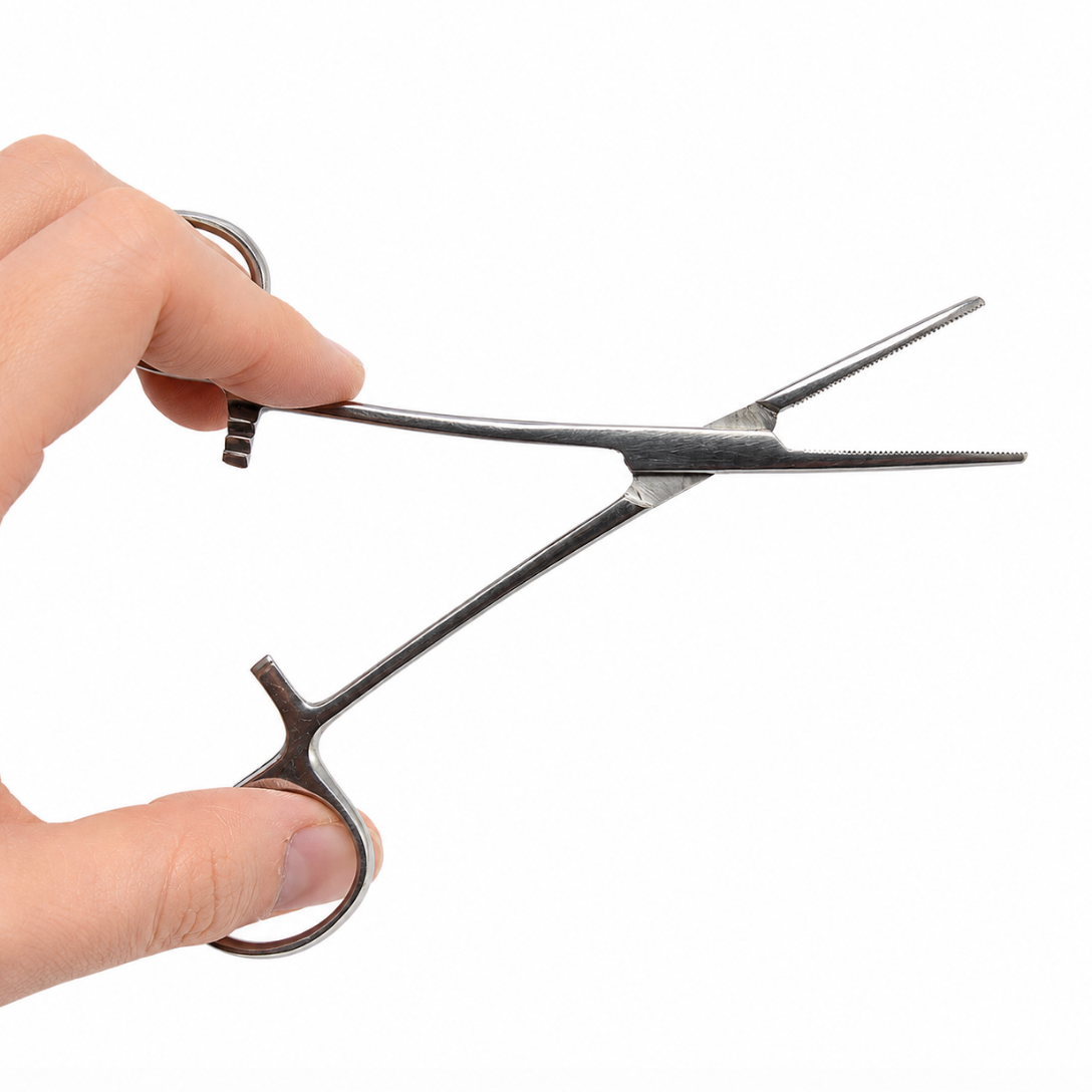 Metal surgical-style clamp with ring handles and serrated jaws held in hand for scale