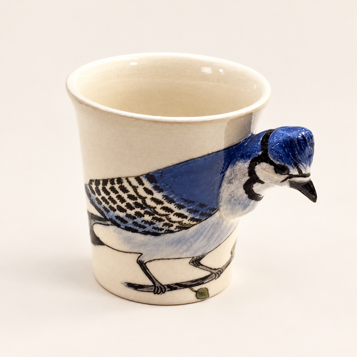 Blue Jay Ceramic Mug on a warm ivory background